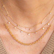 Collier plaque or ron